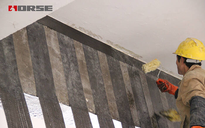 applying carbon fiber fabric for structural strengthening