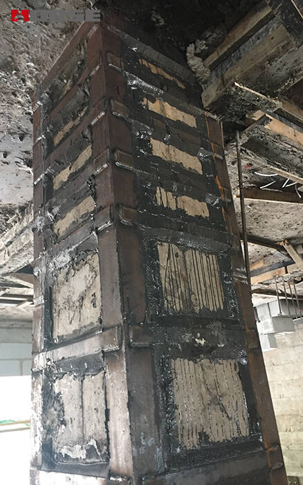Reinforcement of brick columns by steel jacketing