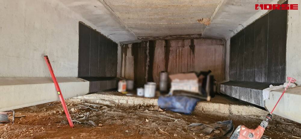 Refuerzo de cizalla de fibra de carbono de pasos a desnivel pretensados