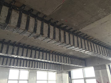 Refuerzo de vigas de hormigón armado (HR) mediante placas de acero