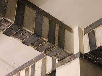 Refuerzo de viga y columna con placa de acero adherida