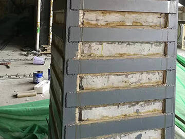 Refuerzo de columnas agrietadas mediante placa de acero unida con epoxi