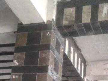 Rehabilitación de la sección debilitada de la viga-columna con tejido de fibra de carbono