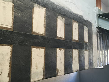 Refuerzo del aumento de carga mediante envoltura de polímero reforzado con fibra (FRP)