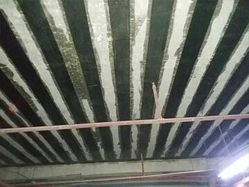 Refuerzo de losa mediante tejido de polímero reforzado con fibra (FRP)