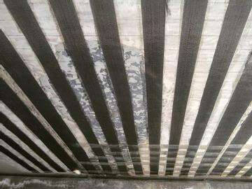 Tratamiento de grietas en forjados de hormigón armado y refuerzo de tejido de fibra de carbono