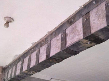 Refuerzo de la base y la superficie de la viga mediante pegado de placas de acero